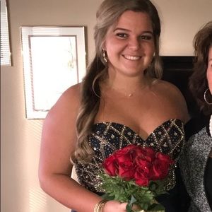 Knee length Prom dress. Navy blue with gold beading on bodice, spaghetti straps